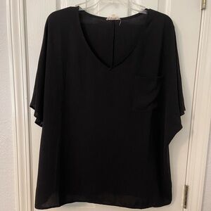 Black short sleeve oversized ladies top.